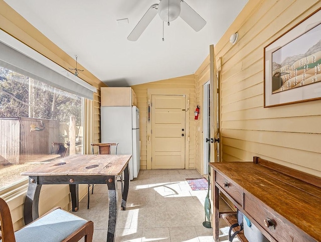 interior space featuring vaulted ceiling and ceiling fan