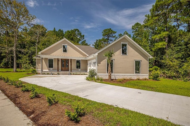 view of front of home with covered porch and a front yard