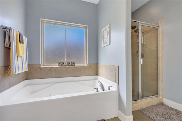 62 Wellington Cir, Brunswick, GA 31525 - full bath with a stall shower, a bath, tile patterned flooring, and baseboards