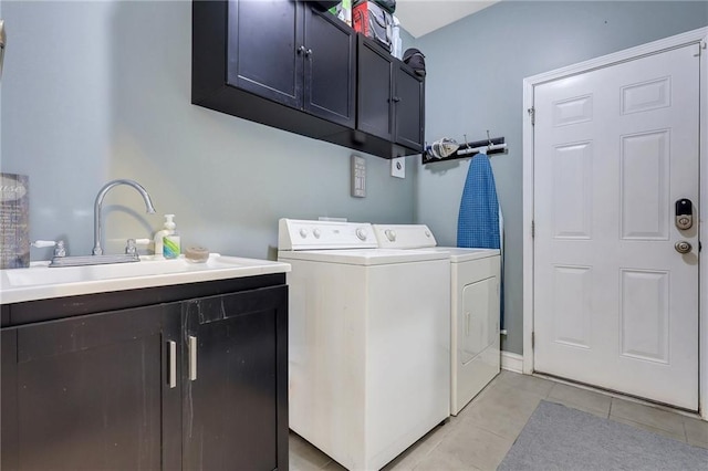 62 Wellington Cir, Brunswick, GA 31525 - laundry area featuring cabinet space, washing machine and clothes dryer, and light tile patterned floors
