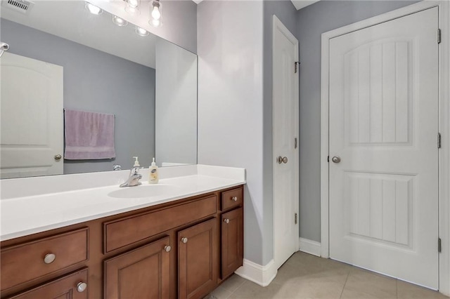 62 Wellington Cir, Brunswick, GA 31525 - bathroom with vanity, tile patterned flooring, and baseboards
