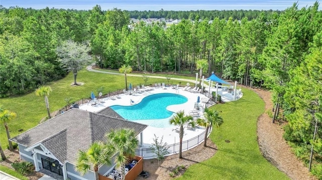 62 Wellington Cir, Brunswick, GA 31525 - community pool with a patio area and a forest view