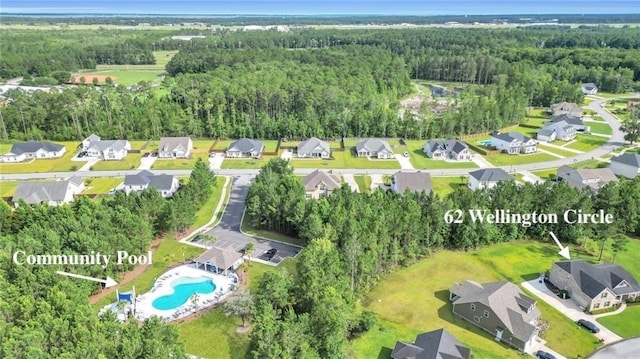 62 Wellington Cir, Brunswick, GA 31525 - view of property location with a heavily wooded area and a pool area
