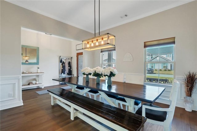 62 Wellington Cir, Brunswick, GA 31525 - dining area featuring healthy amount of natural light, dark wood-style floors, and wainscoting