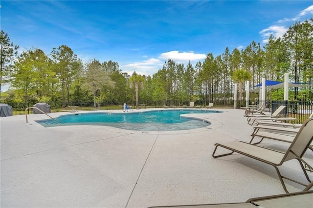 62 Wellington Cir, Brunswick, GA 31525 - community pool with a patio area and view of wooded area