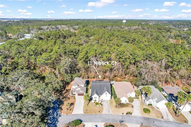 aerial view with a residential view and a wooded view