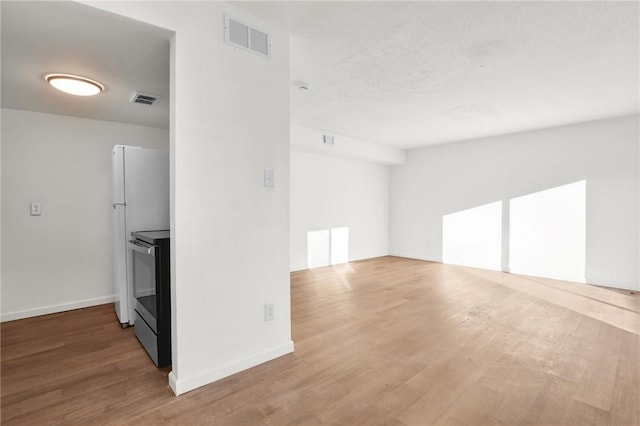 unfurnished room with hardwood / wood-style floors