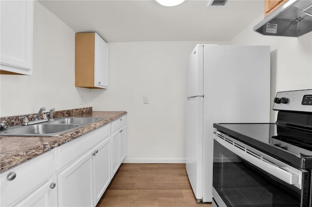 kitchen featuring light wood-type flooring, electric range, white cabinetry, and sink