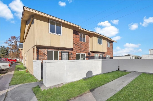 view of home's exterior with a yard