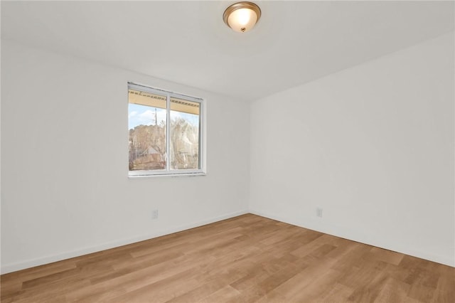 empty room with light wood-type flooring