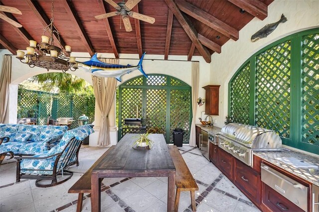 view of patio featuring area for grilling, ceiling fan, and a grill