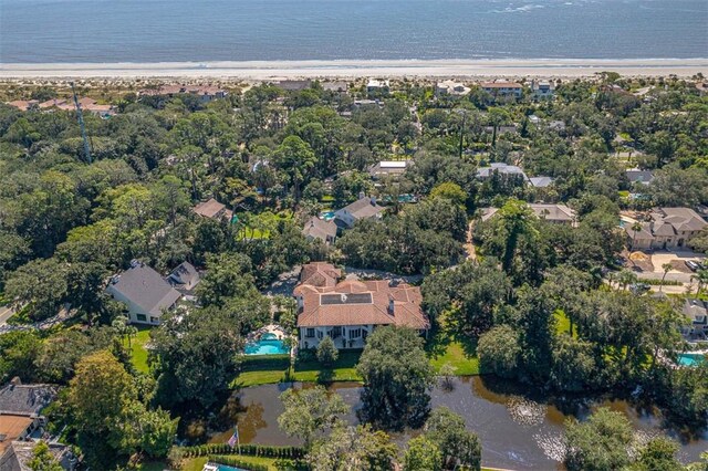 bird's eye view featuring a view of the beach and a water view