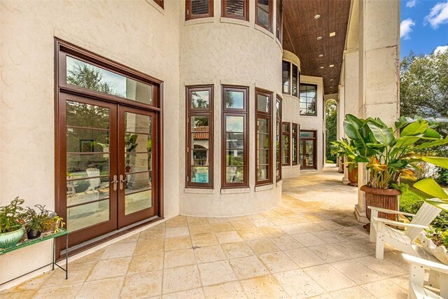 view of exterior entry featuring french doors