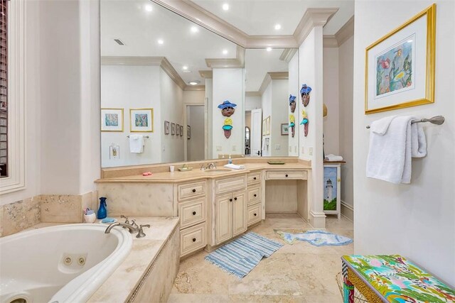 bathroom with vanity, crown molding, and tiled tub