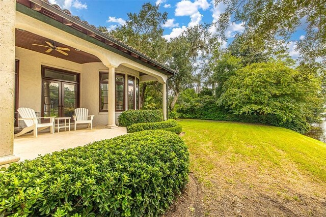 view of yard with ceiling fan