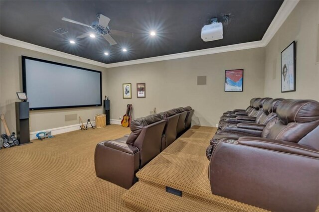 cinema room with carpet, ceiling fan, and crown molding