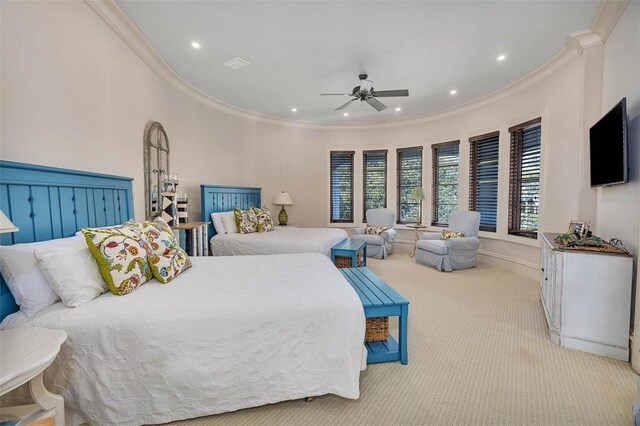 carpeted bedroom with ceiling fan and crown molding