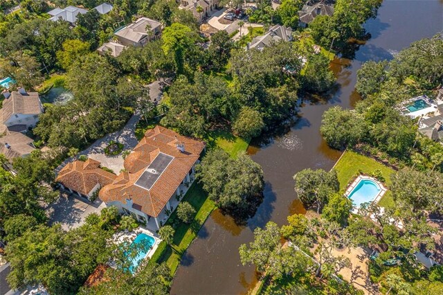 birds eye view of property featuring a water view