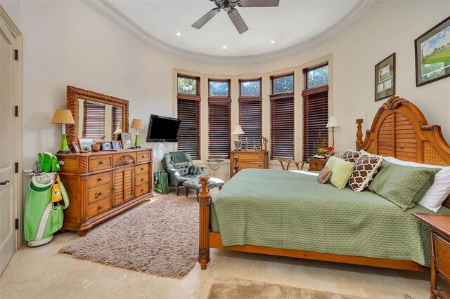 bedroom featuring multiple windows, ceiling fan, and ornamental molding