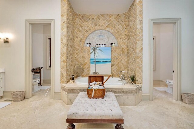 bathroom with a relaxing tiled tub, toilet, and tile walls