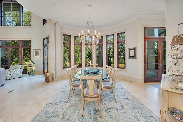 dining space featuring crown molding, a wealth of natural light, and french doors