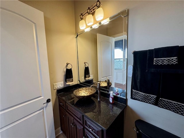 bathroom with vanity and toilet