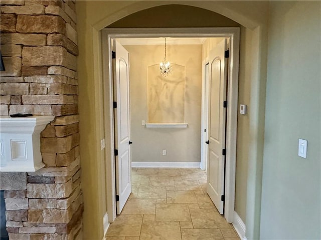 corridor with a chandelier