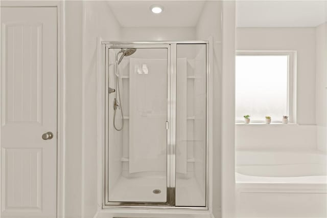 288 Chestnut Dr, Brunswick, GA 31523 - bathroom featuring a stall shower, a bath, and recessed lighting