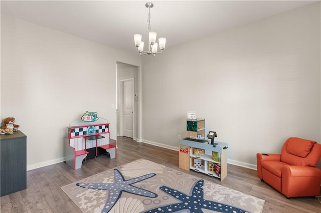 288 Chestnut Dr, Brunswick, GA 31523 - recreation room with a chandelier and wood finished floors