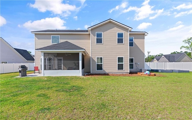 288 Chestnut Dr, Brunswick, GA 31523 - back of house with a sunroom, a patio area, and a fenced backyard