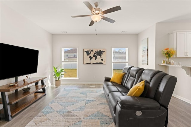 288 Chestnut Dr, Brunswick, GA 31523 - living area with a ceiling fan and light wood-type flooring