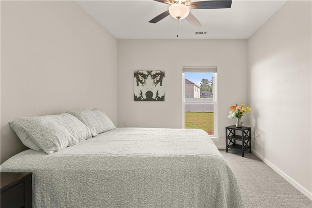 288 Chestnut Dr, Brunswick, GA 31523 - carpeted bedroom with baseboards and ceiling fan