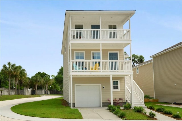 view of front of property featuring a balcony, an attached garage, stairs, concrete driveway, and covered porch