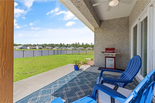 view of patio featuring area for grilling and ceiling fan