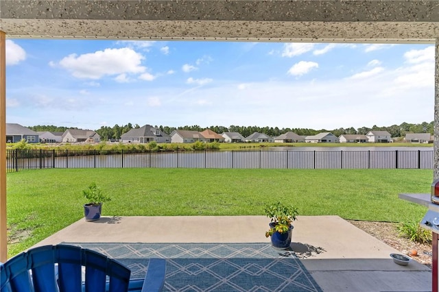 view of yard with a patio and a water view