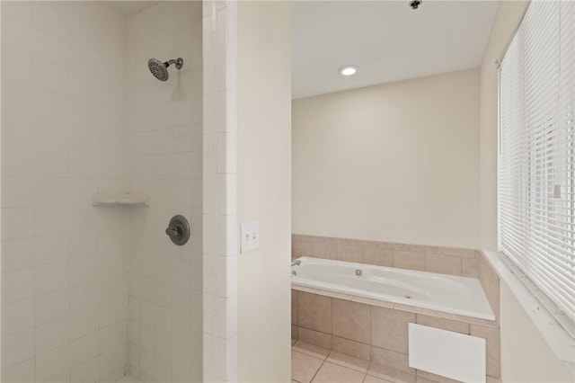 91 Screven St, Darien, GA 31305 - bathroom with tiled shower, a garden tub, and tile patterned flooring
