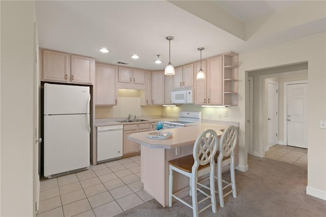 91 Screven St, Darien, GA 31305 - kitchen featuring white appliances, light countertops, open shelves, light brown cabinets, and light tile patterned flooring