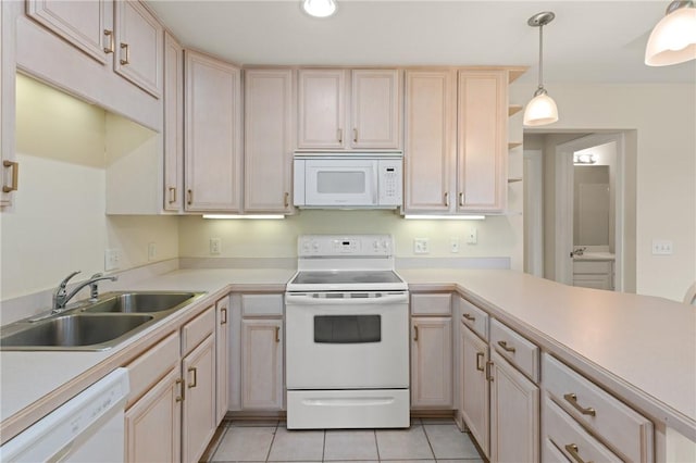 91 Screven St, Darien, GA 31305 - kitchen with white appliances, light tile patterned flooring, light countertops, hanging light fixtures, and recessed lighting