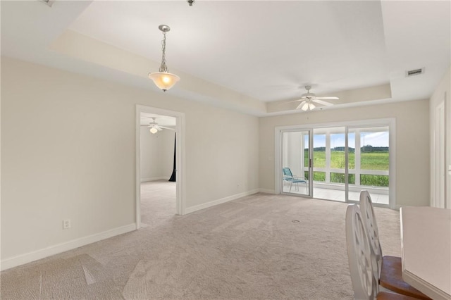 91 Screven St, Darien, GA 31305 - carpeted spare room with a tray ceiling and ceiling fan