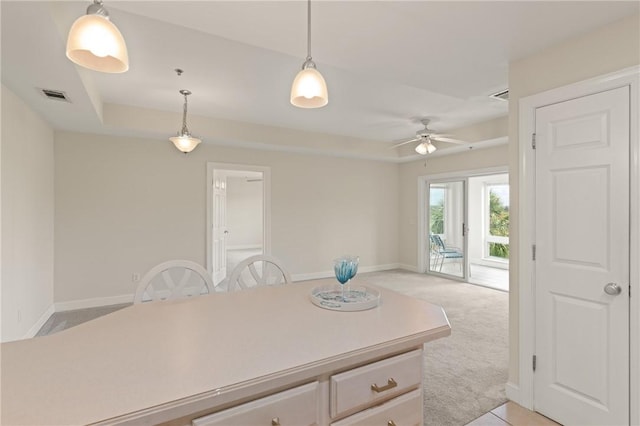91 Screven St, Darien, GA 31305 - kitchen with pendant lighting, a ceiling fan, light carpet, and light countertops