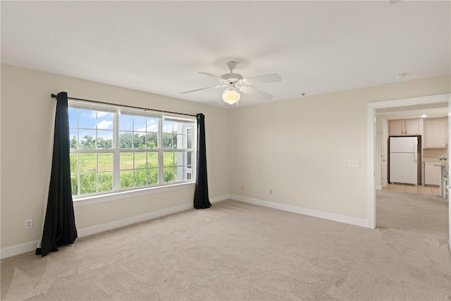 91 Screven St, Darien, GA 31305 - empty room with light colored carpet and ceiling fan