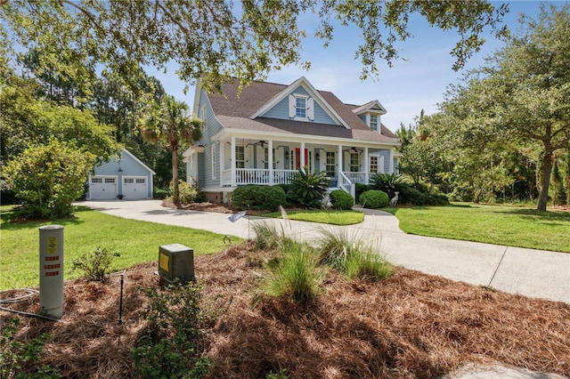 view of front of house featuring a porch, a garage, an outdoor structure, and a front yard