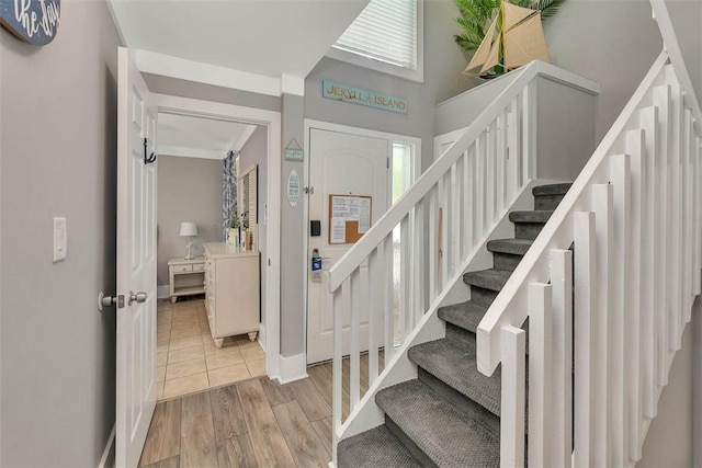 1175 N Beachview Dr Unit 414, Jekyll Island, GA 31527 - stairs with wood finished floors and baseboards