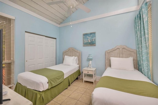 1175 N Beachview Dr Unit 414, Jekyll Island, GA 31527 - bedroom with vaulted ceiling, light tile patterned flooring, a closet, ceiling fan, and wooden ceiling