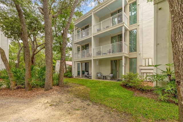 1175 N Beachview Dr Unit 414, Jekyll Island, GA 31527 - back of house with a balcony and a patio