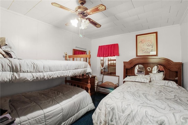 bedroom featuring ceiling fan and ornamental molding