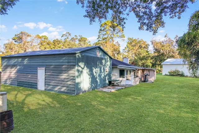 rear view of house with a lawn