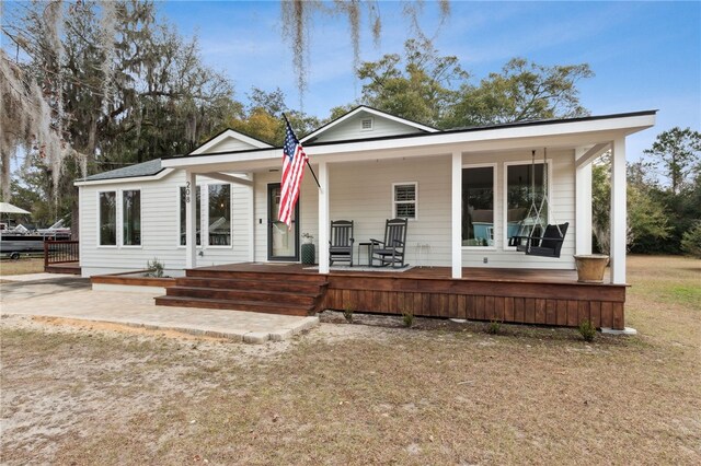 208 Bishop Cir, Saint Marys, GA 31558 - back of house featuring a porch