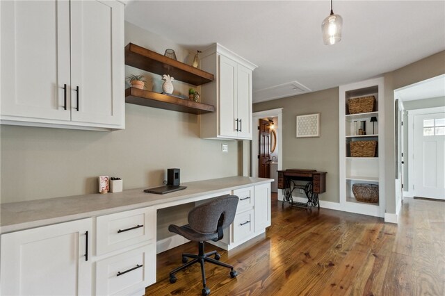 208 Bishop Cir, Saint Marys, GA 31558 - home office with built in study area, dark wood-style flooring, and built in features