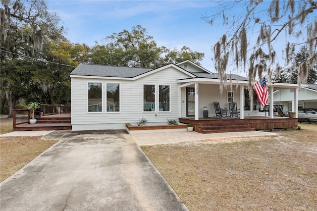 208 Bishop Cir, Saint Marys, GA 31558 - view of front facade with a deck, roof with shingles, and concrete driveway